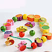 Іграшкова дерев'яна каталка Левеня 3в1 Шнурівка з фруктами сортер за кольорами та вежа палички ранній розвиток, фото 6