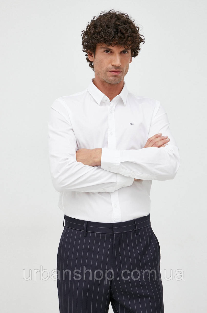 Urbanshop com ua Сорочка Calvin Klein чоловіча колір білий slim класичний комір РОЗМІРИ ЗАПИТУЙТЕ