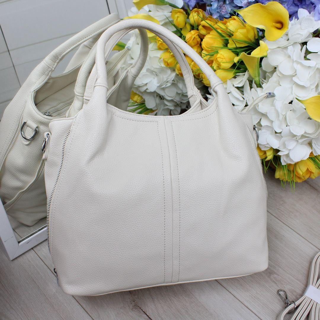 Жіноча сумка-мішок з блискавками з боків містка модна молочна екошкіра