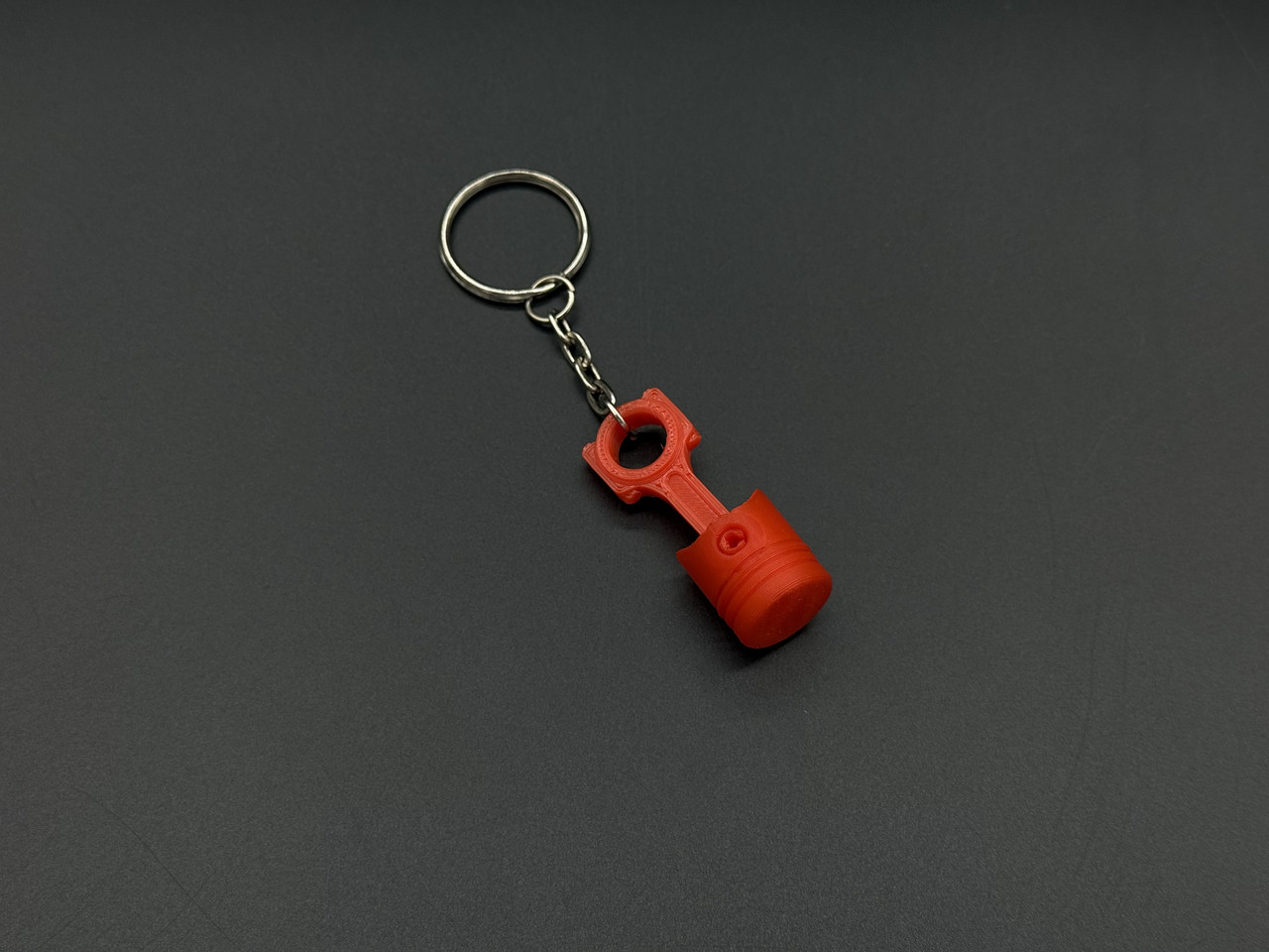 Брелок-підвіска для ключів сумки рюкзака 3D Поршень червоний. 42х16мм