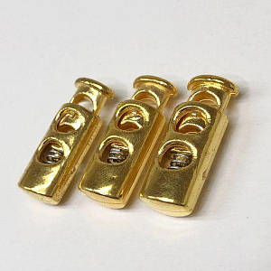 Фіксатор для шнура пластиковий 23 мм, колір: золото