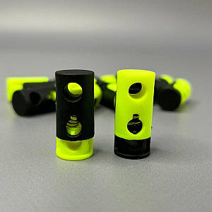 Фіксатор для шнура пластиковий, чорний/салатовий - 20 мм