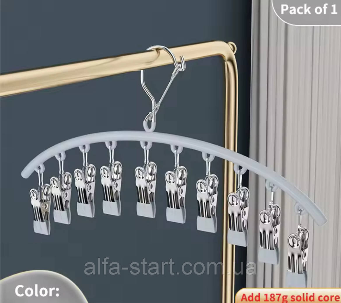 Металева вішалка з прищіпками для одягу