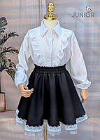 Біла шкільна блуза з довгим рукавом і рюшами (116-140р).