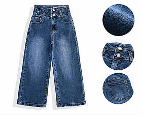 Широкі сині джинси на дівчинку