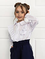 Біла шкільна блуза з довгим рукавом і рюшами (134-152р).