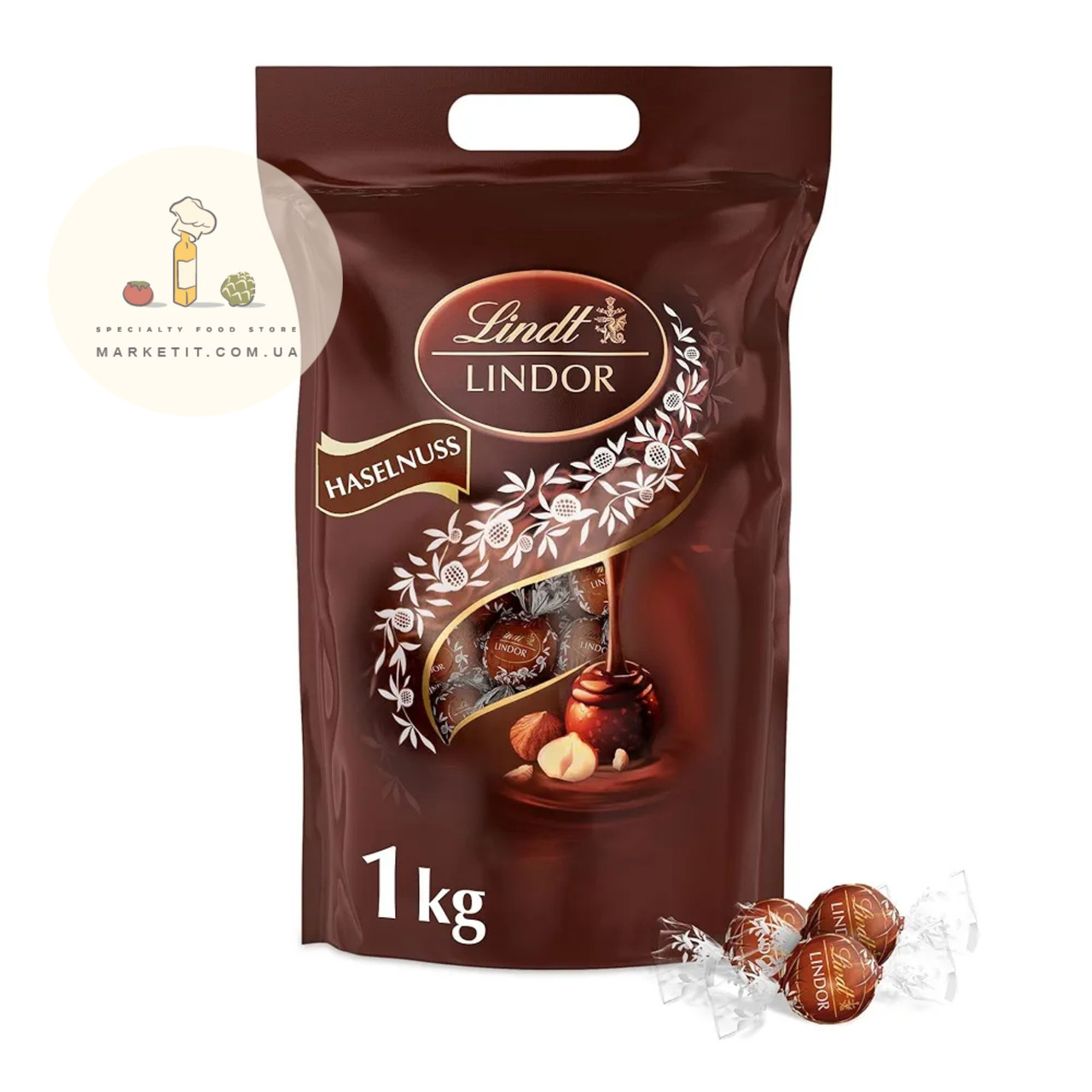Шоколадні цукерки Lindt Lindor Haselnuss з горіховим праліне 1 кг., фото 1
