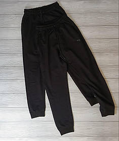 Стильні однотонні чоловічі спортивні штани чорного кольору