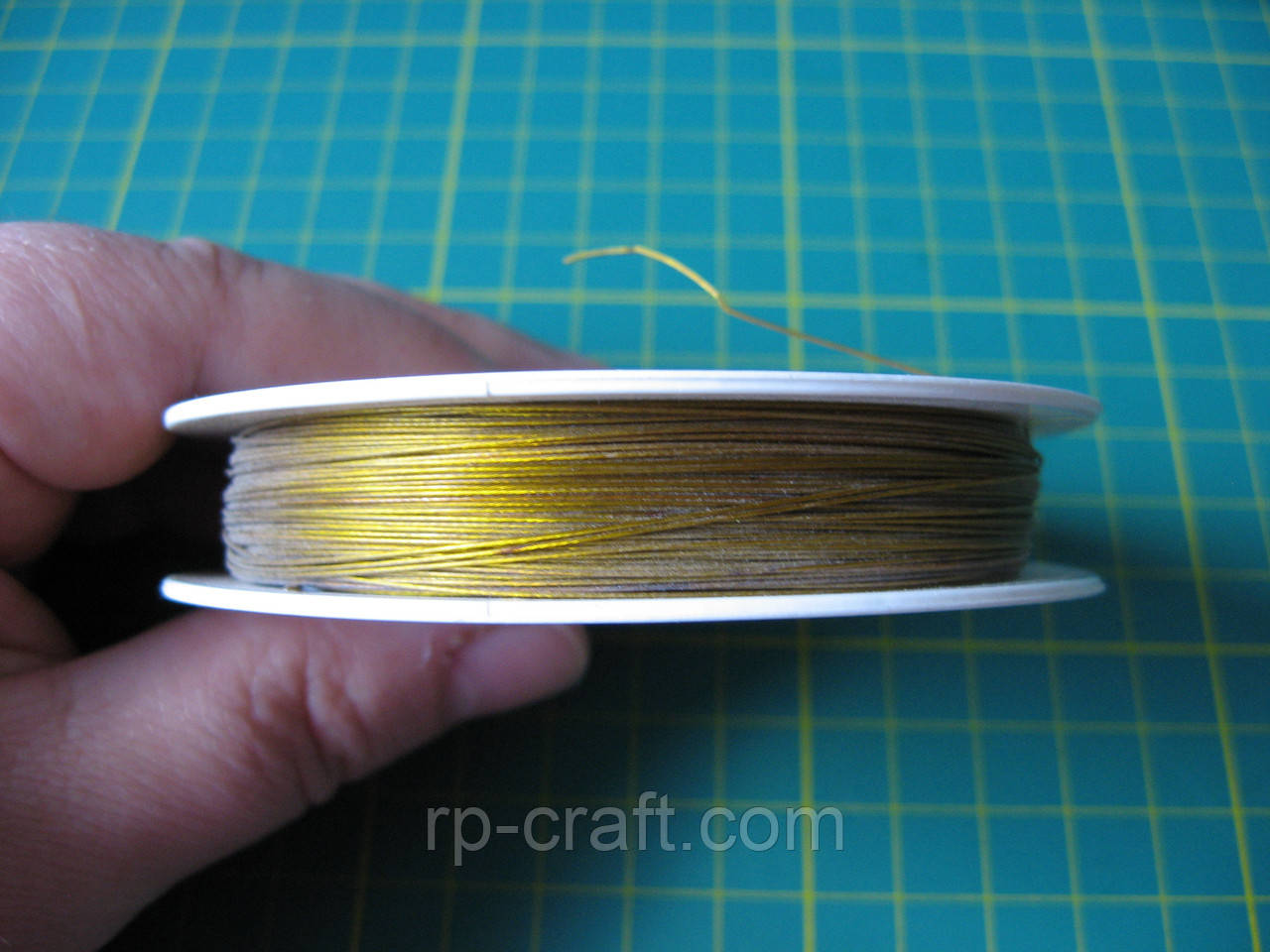 Біжутерний трос, товщина 0,38 мм, темне золото, фото 1