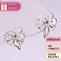 Сережки пусети Банти серія 925 камені колір білий 12х14мм метал сріблястий купити біжутерію дешево оптом в інтернеті