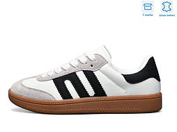 Стильні жіночі кросівки в білому кольорі з коричневою підошвою