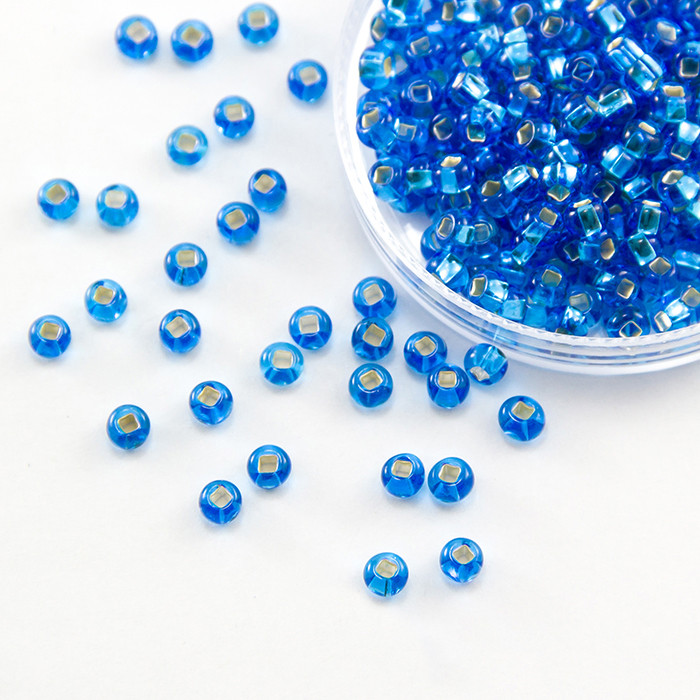 Бісер 67150 Чеський Preciosa 6/0, Прозорий зі срібною смугою TSL, Синій, Круглий, 50 г, фото 1