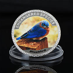 Сувенір монета "Синя птиця" із серії «Існувальні різновиди тварин»