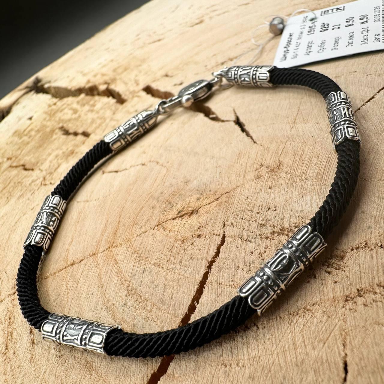 Чоловічий браслет із шовкового чорного шнурка із 4 срібними вставками 925 проби