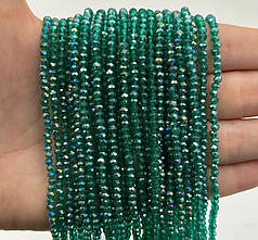 Намистини кришталеві 2,4х3 мм, смарагдовий прозорий з АБ (уп.165-175 шт)