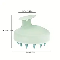 Силіконова масажна щітка середньої жорсткості, зручна форма з ремінцем для руки, ідеальна для догляду за тілом у душі.