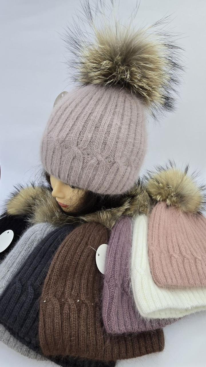 Шапки жіночі та молодіжні ангора з помпоном єнота оптом