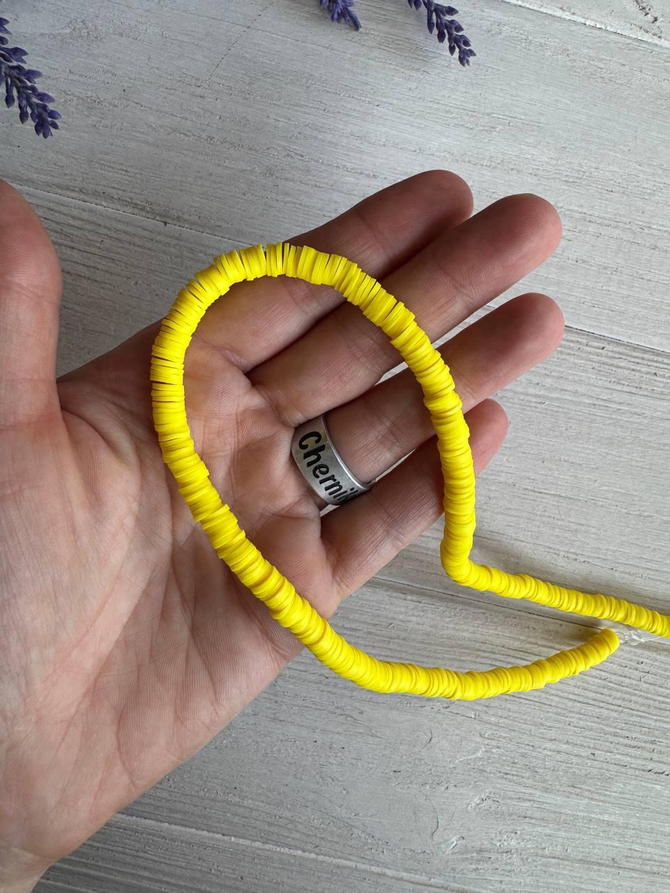 Нитка намистини плоскі 6 мм каучук, жовті 40 см