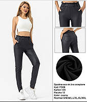 Брюки жіночі екокожа , на резинці з кишенями . тонкий фліс .