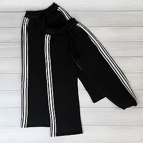 Чорні дитячі теплі спортивні штани з регулюванням внизу