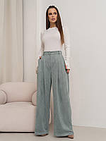 Оливковые брюки палаццо свободного кроя из эко-замши с карманами