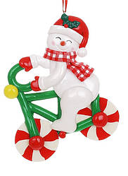 Ялинкова іграшка Карамельний Сніговик на велосипеді 12 см