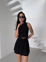 Жіночий в язаний костюм двійка: укорочений топ і спідниця