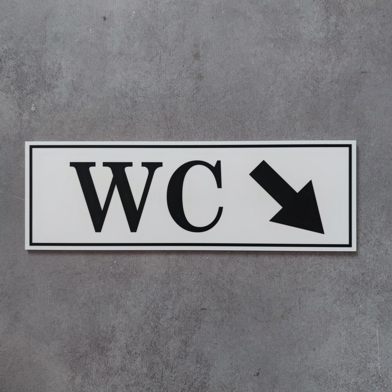WC (Туалет). Табличка із вказівною стрілкою