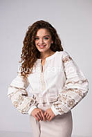 Жіноча блуза вишиванка прикрашена орнаментом хрестиком молочна