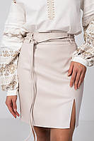 Жіноча коротка спідниця з екошкіри кольору слонової кістки