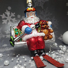 Скляна ялинкова прикраса Санта Клаус на гірськолижному підйомнику Impuls. асортимент як Irena, Komozja