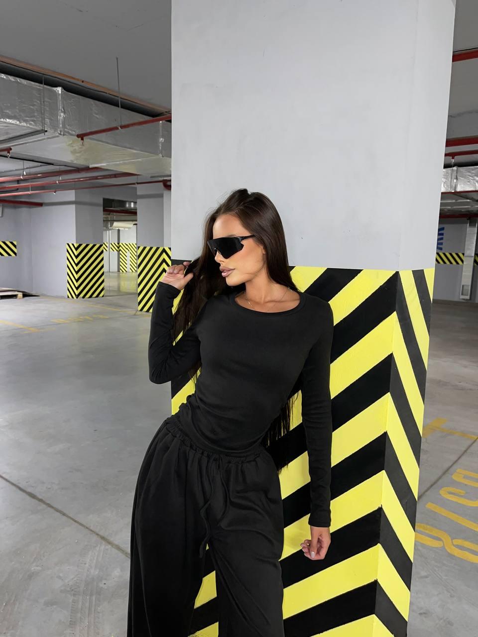 Чорний жіночий базовий жіночий костюм-двійка з м'якого трикотажу Пума: Жіночий лонгслів та вільні Штани, фото 1