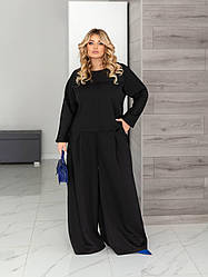 Жіночий костюм із широкими брюками