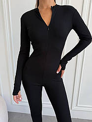 Чорний однотонний жіночий обтягуючий комбінезон у рубчик з довгим рукавом та застібкою-блискавкою