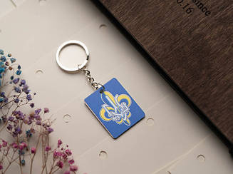 Брелок металевий з УФ-друком. Тризуб синього кольору 33х43мм