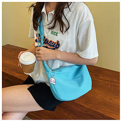 Сумка-мессенджер блакитна з брелком