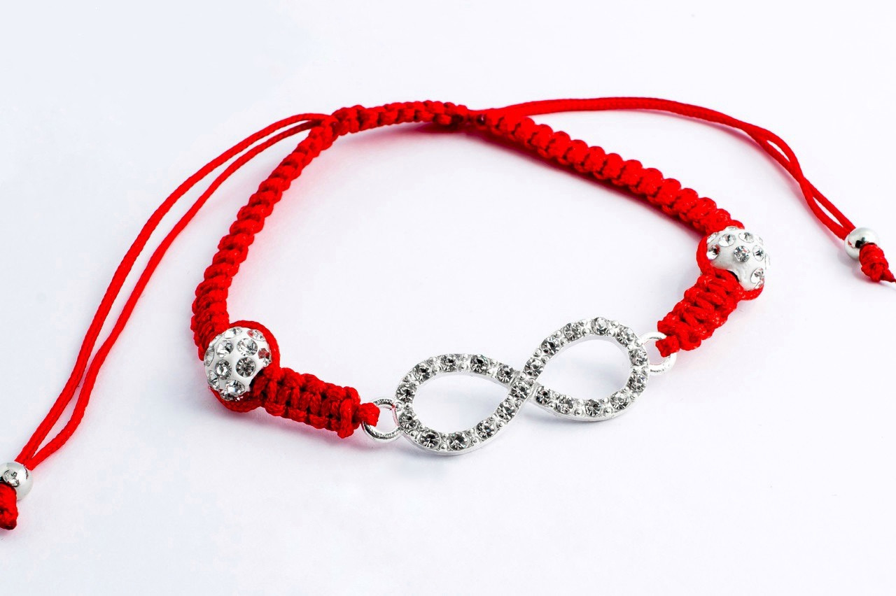 Червона нитка зі знаком нескінченності