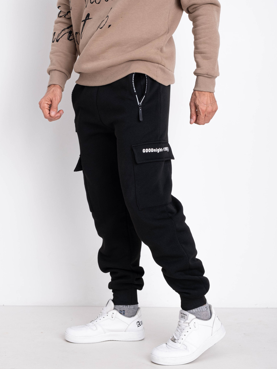 Спортивні теплі чоловічі штани з кишеннями зимові з манжетом трикотаж на флісі чорні