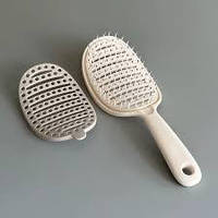 Самоочищаюча щітка для волосся з подвійним шаром у основи зубців