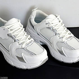 Комбіновані білі шкіряні текстильні кросівки зі сріблястими вставками