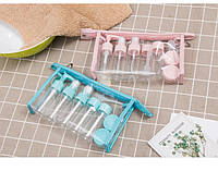 Дорожній набір флаконів для косметики 11 предметів у прозорій косметичці