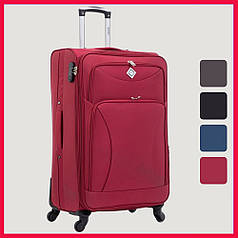 Дорожня Валіза Bonro Tourist середня вишнева на коліщатках з висувною ручкою та кодовим замком.