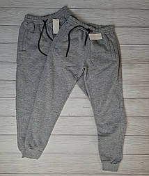 Спортивні чоловічі штани на манжетах  у сірому кольорі