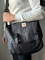 Велика сумка через плече Carhartt Delta Shoulder Pouch у чорному кольорі.