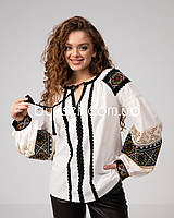 Вишита блуза з об'ємними рукавами та геометричним орнаментом молочна