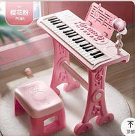 Детское пианино-синтезатор 6655 на ножках со стульчиком и микрофоном Розовый