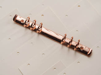 Затискачі канцелярські для папок меню. Колір "рожеве золото". 230х20мм. Кільце 25мм