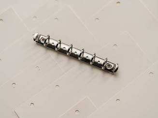 Затискачі канцелярські для блокнотів і папок. 140х15 мм. Кільце 15мм