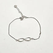 Срібний браслет з підвіскою у вигляді знака нескінченність і білими фіанітами