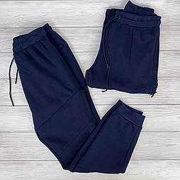 Теплі чоловічі спортивні штани на манжеті в темно -синьому кольорі